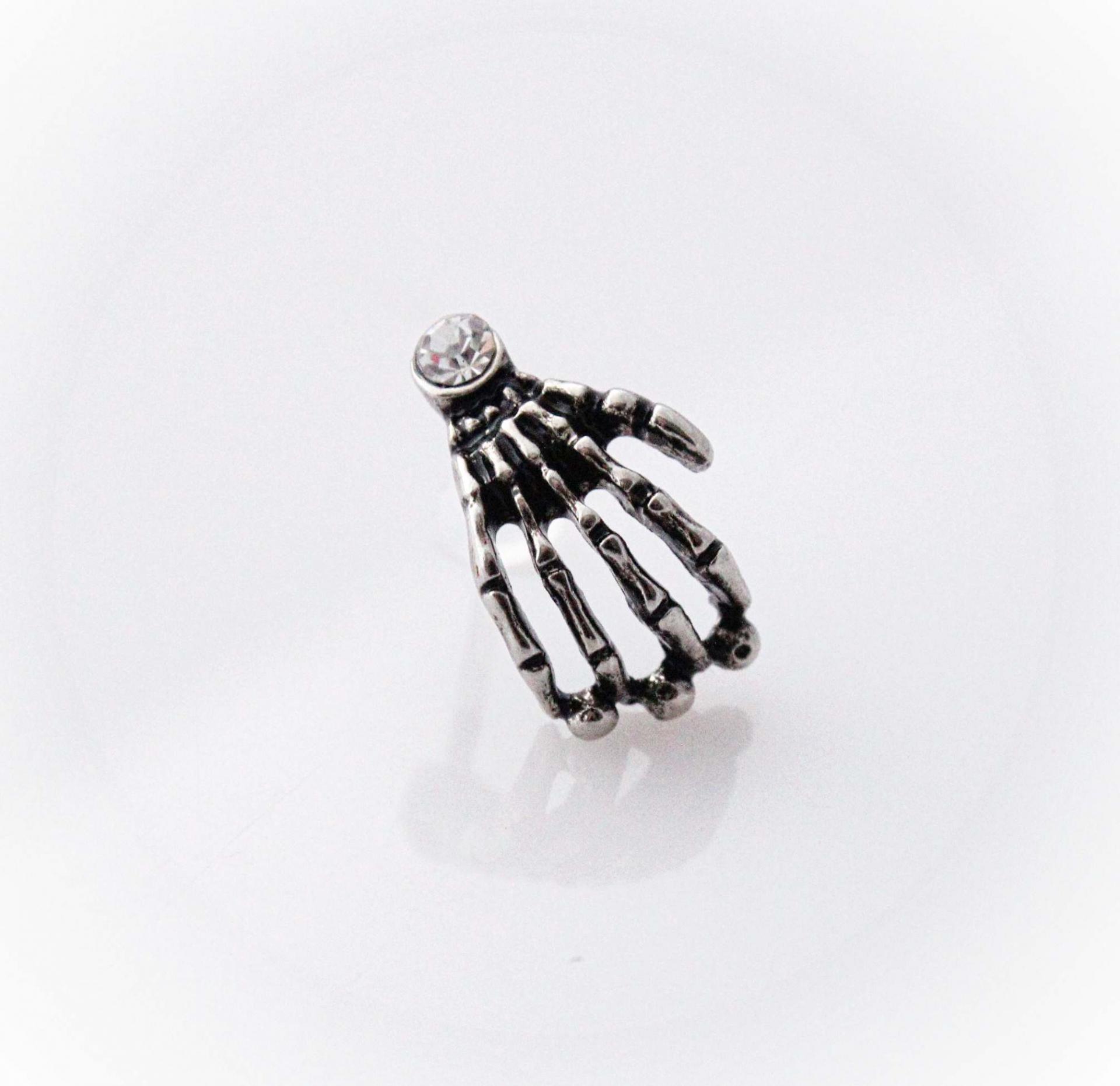 Skull Hand Bioplast Body Jewellery With Crystal Gem